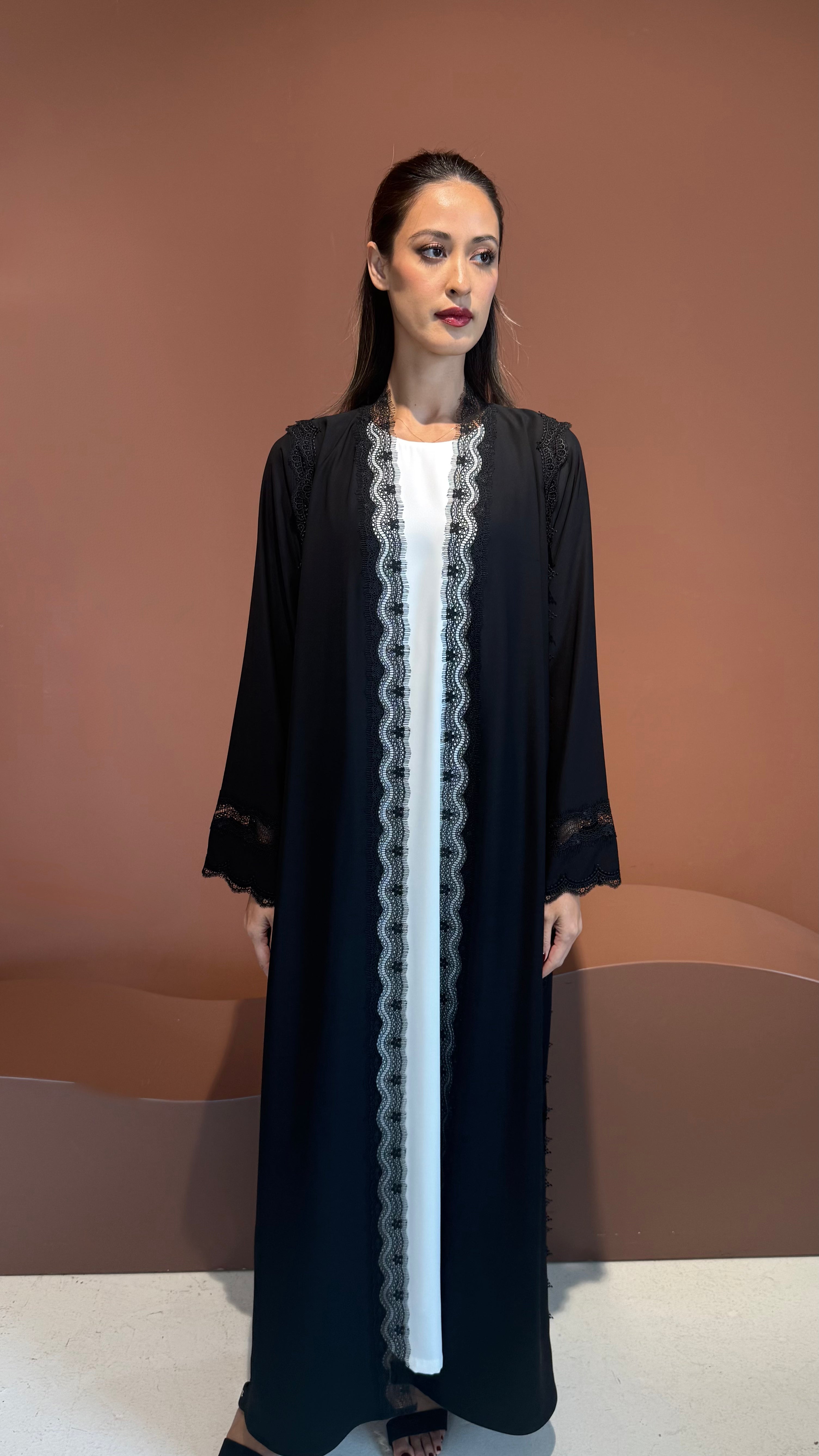 Noir lace abaya.