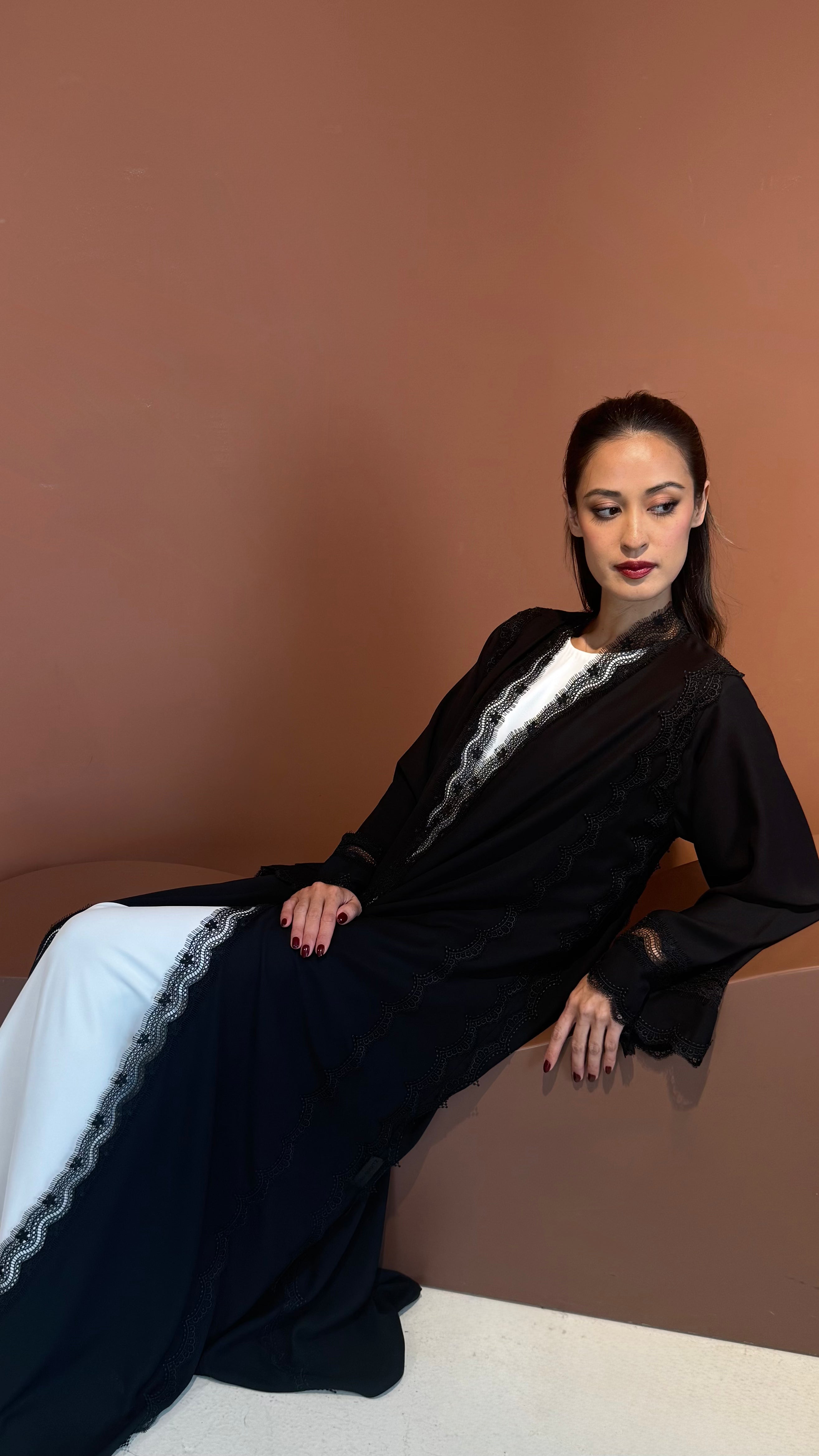 Noir lace abaya.